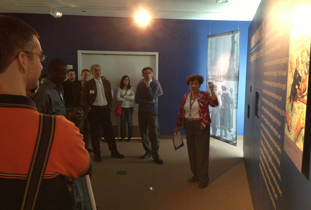 The second group listens to the tour guide, a passionate descendant of Greek immigrants